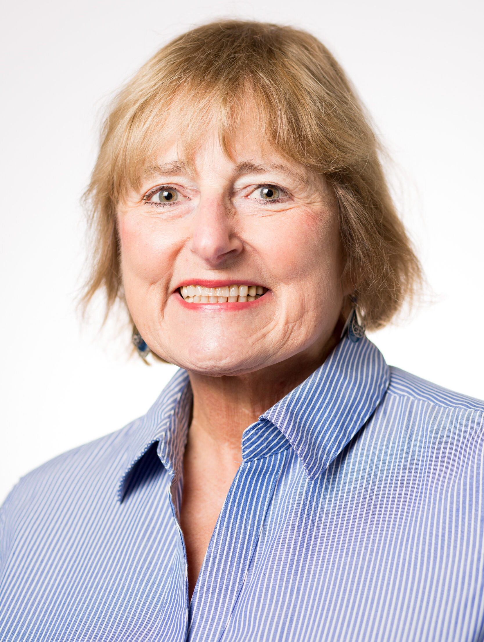 Karen Harper in a blue blouse.