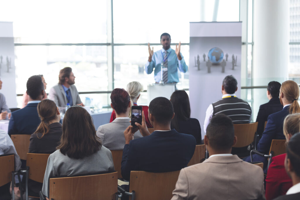 A man speaking at a business seminar