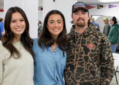 3 representatives from Frampton Construction smiling. Two are women, one is a man.