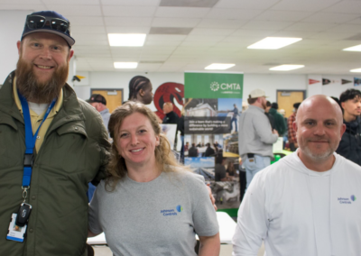 3 representatives from Frampton Construction smiling. Two are men, one is a woman.